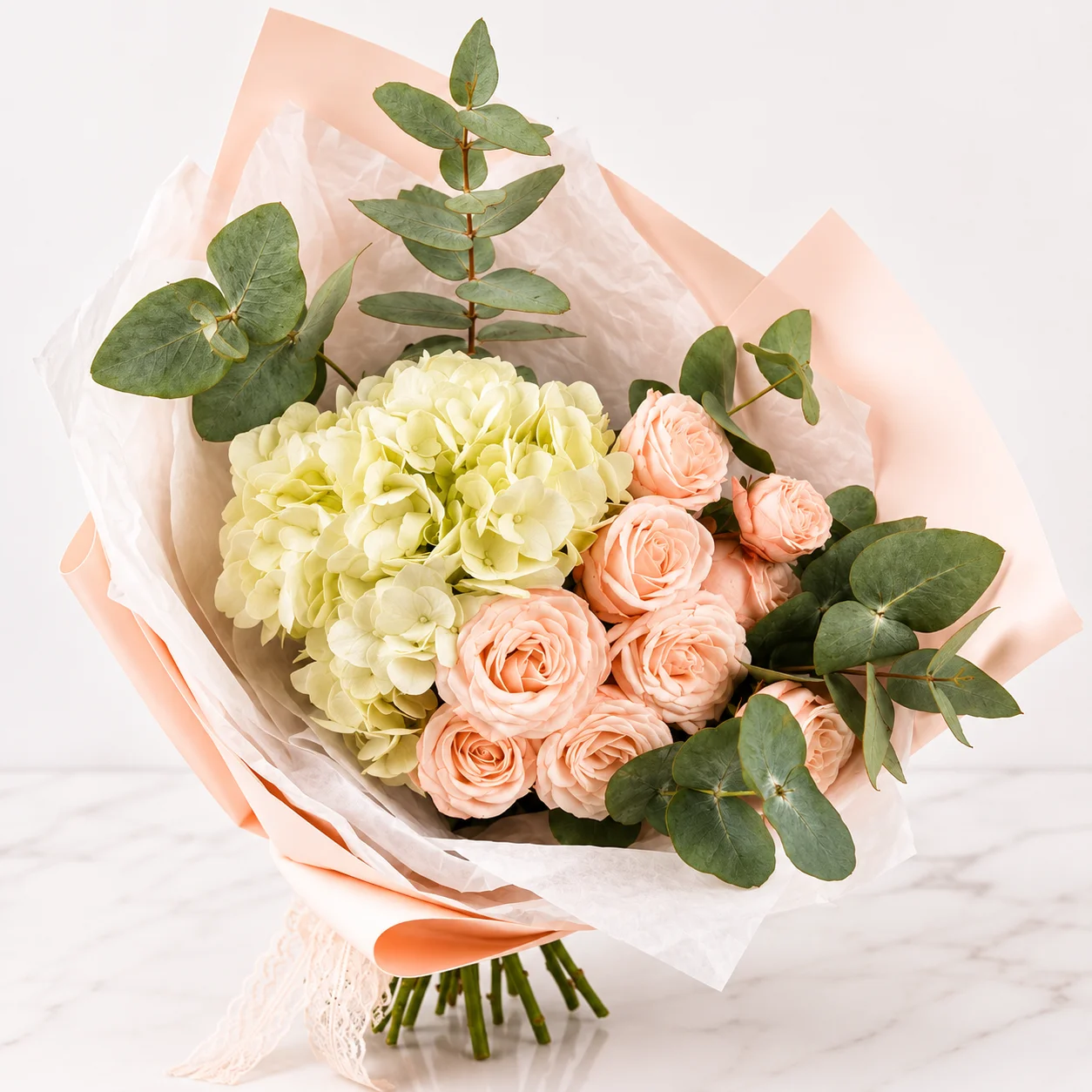 Peony Touch – Hydrangea Pink Peony Bouquet featuring fresh white hydrangea and pink peony roses beautifully arranged in premium wrapping